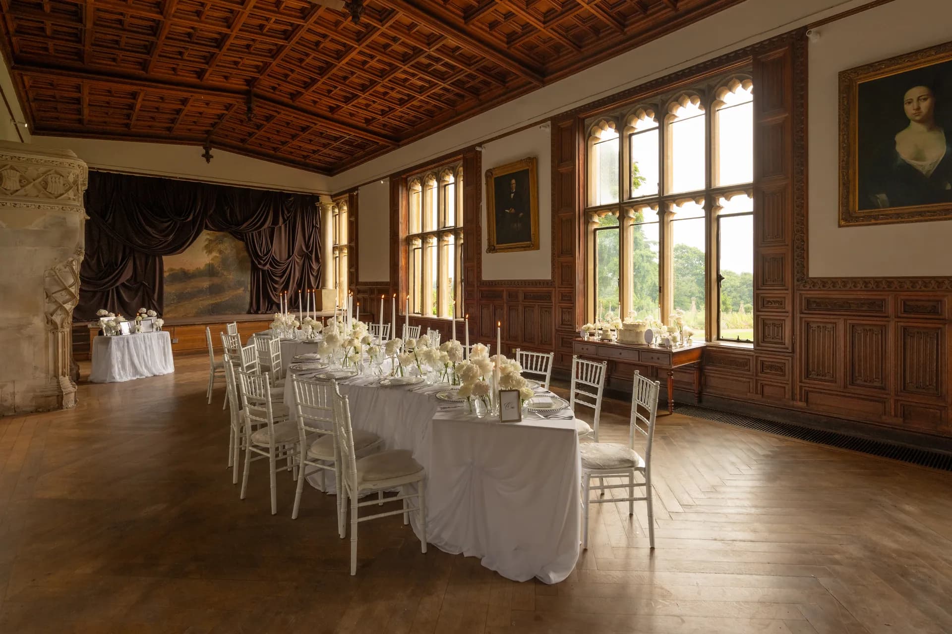 The Music Room dressed for a wedding breakfast, long table and gilt chairs