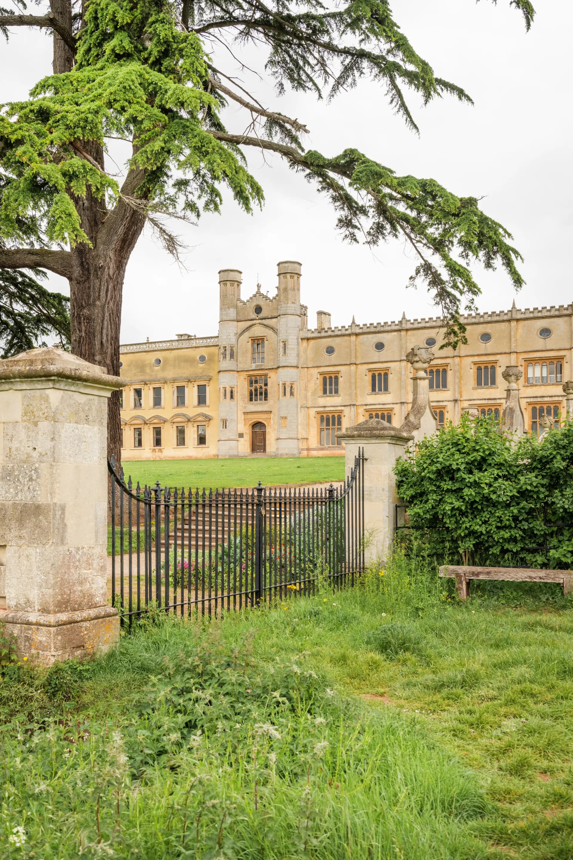 The Mansion from the lawn through the railings and gate